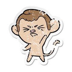 distressed sticker of a cartoon annoyed monkey