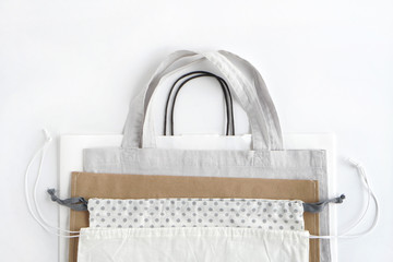 Shopping bags on white background.Cotton and paper bags for free plastic shopping.