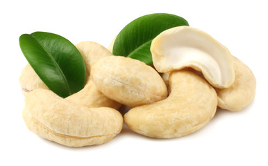 cashew with green leaves isolated on white background