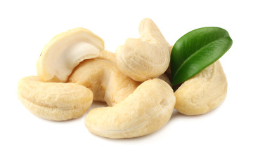 cashew with green leaves isolated on white background