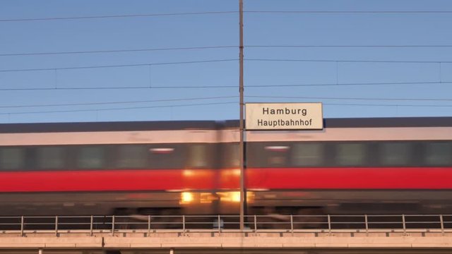 Hamburg Railway Billboard Train Passing Behind Train Station Signboard