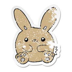 distressed sticker of a cartoon rabbit