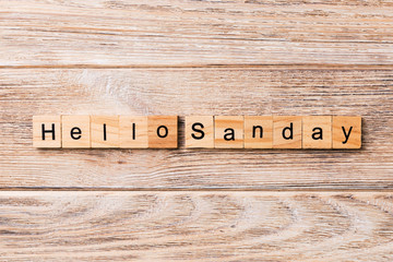 hello sunday word written on wood block. hello sunday text on wooden table for your desing, concept