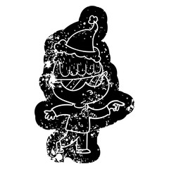 cartoon distressed icon of a boy wearing sunglasses pointing wearing santa hat