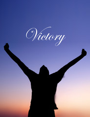 Man Celebrating at Sunset with Victory text