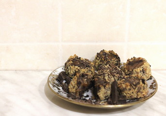chocolate-nut cookies on a plate on the kitchen table