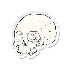 retro distressed sticker of a cartoon old skull