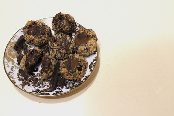  chocolate-nut cookies on a plate on the table top view