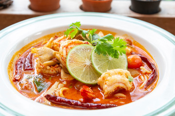 Close up Tom Yum Kung on plate ,spicy Thailand food and Street Food