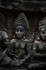 Several ancient statues at Angkor Wat in Cambodia