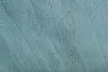 Water drops close up. Abstract white background of waterdrops