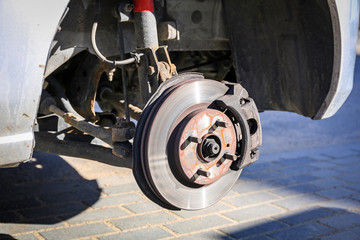 Front wheel brake in the car at tire change