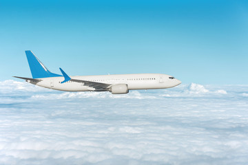 Fototapeta na wymiar Airplane flying above the clouds, side view