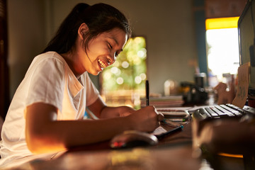 Fototapeta thai teen girl doing homework and studying at home obraz