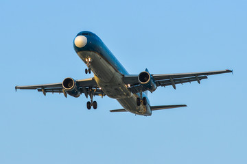 Passenger airplane landing at the airport