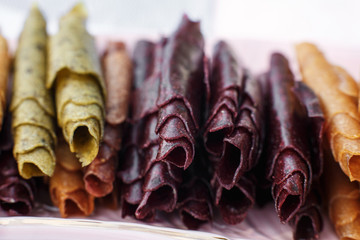 Closeup set of colorful pastillum rolls on tray