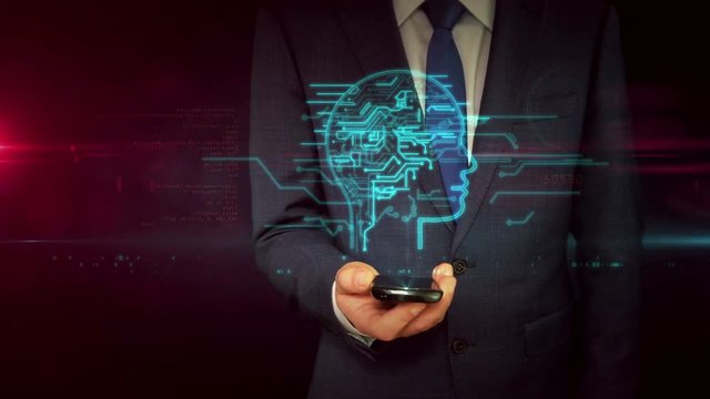 Businessman in suit using smartphone with cyber head shape hologram. Artificial intelligence, deep machine learning and cybernetic brain symbol abstract concept. Futuristic technology animation.