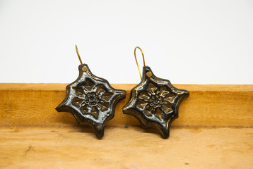 Arabic black and gold earrings isolated. Handmade fashion jewelry.