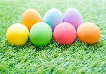 Fototapeta na wymiar Colorful Easter eggs on green grass