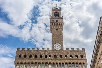 Obraz premium Italy,Florence, Palazzo Vecchio, a large tall tower with a clock at the top of Palazzo Vecchio