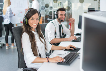 Friendly customer service agents working in call center