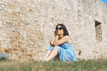 Fototapeta na wymiar woman in sunglasses on grass