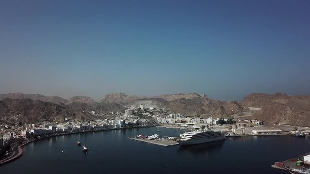 City of Mutrah, Muscat, Oman with the yacht of the Sultan Qaboos in first plan