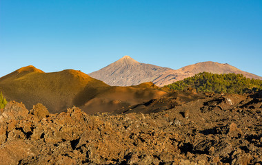 Spectacular volcanic landscape with old lava flow at sunset.