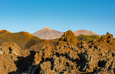 Spectacular volcanic landscape with old lava flow at sunset.