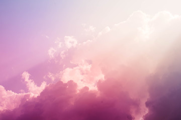 Purple and pink sky with fluffy clouds