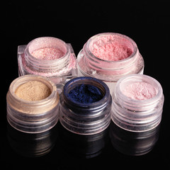 Set Of Colorful Mineral Eye Shadows On Black Background