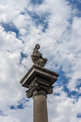 Fototapeta na wymiar Italy,Florence, a tall clock tower sitting under a cloudy blue sky