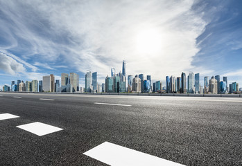 Empty asphalt road and panoramic city skyline with buildings in Shanghai