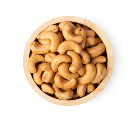 Roasted cashew nuts with salted in wood bowl isolated on white background