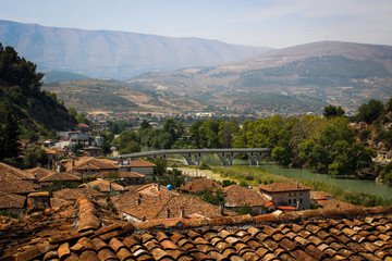 Scenic view of the bridge and the ancient city of Berat with a tiled ocher roof. Albania, the Balkans.