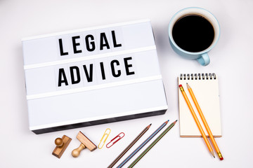 Legal Advice. Text in lightbox. White desk with stationery