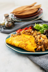 French Omelette with Potatoes, Mushroom and Salad