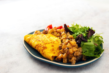 French Omelette with Potatoes, Mushroom and Salad