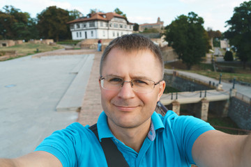 handsome man making selfie