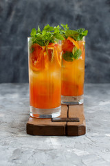 Homemade refreshing drink with bloody orange juice and mint