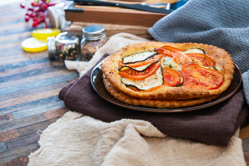 Fine Tomato Zucchini Tarts Mozzarella, pesto and virgin olive oil