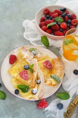 Homemade Crepes with fresh fruits and berries, selective focus
