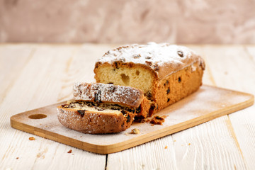 Delicious homemade cake with raisins on a light wooden background. close-up. rustic. copy space.