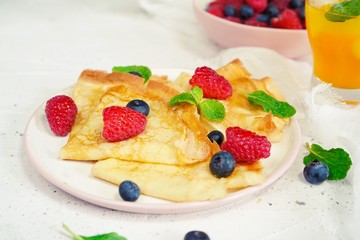 Homemade Crepes with fresh fruits and berries, selective focus