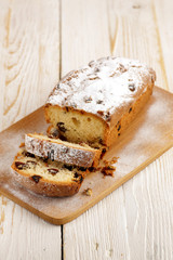 Delicious homemade cake with raisins on a light wooden background. close-up. rustic. copy space.