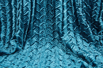 Full frame teal blue luxury shiny draped curtain