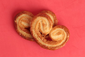 Puff pastry cookies on colorful background