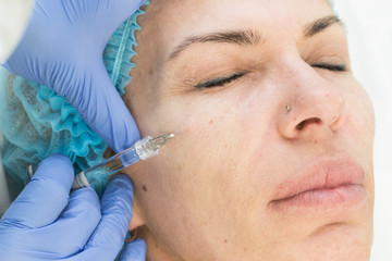 Cosmetic surgery, medicine procedure for an adult woman in a cosmetology clinic. 