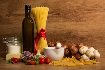 still life pasta, garlic, olive oil, tomatoes, cheese