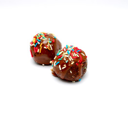 two homemade chocolate balls on white